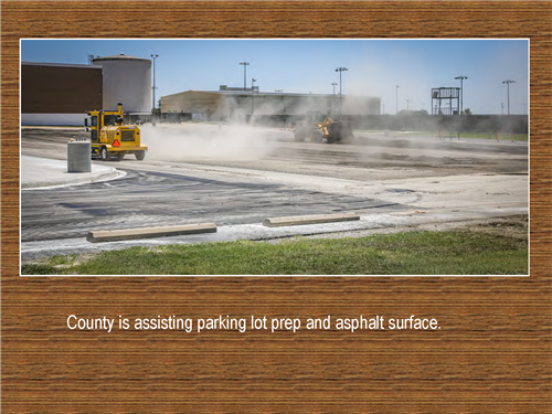 Photo of county assisting parking lot prep and asphalt surface.